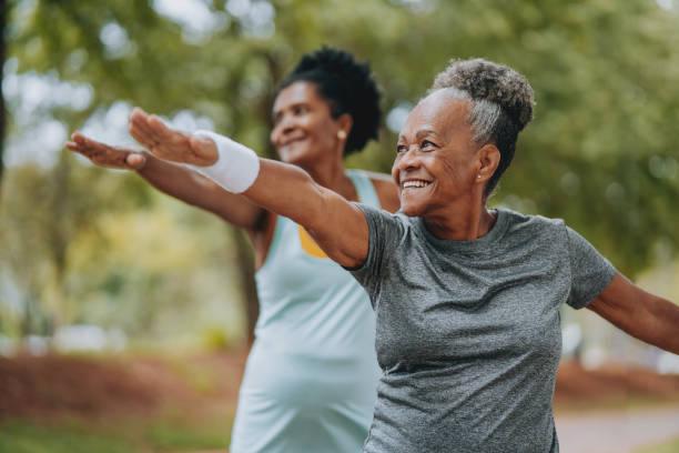 Two women enjoying outdoor exercise and active living at Harmony House